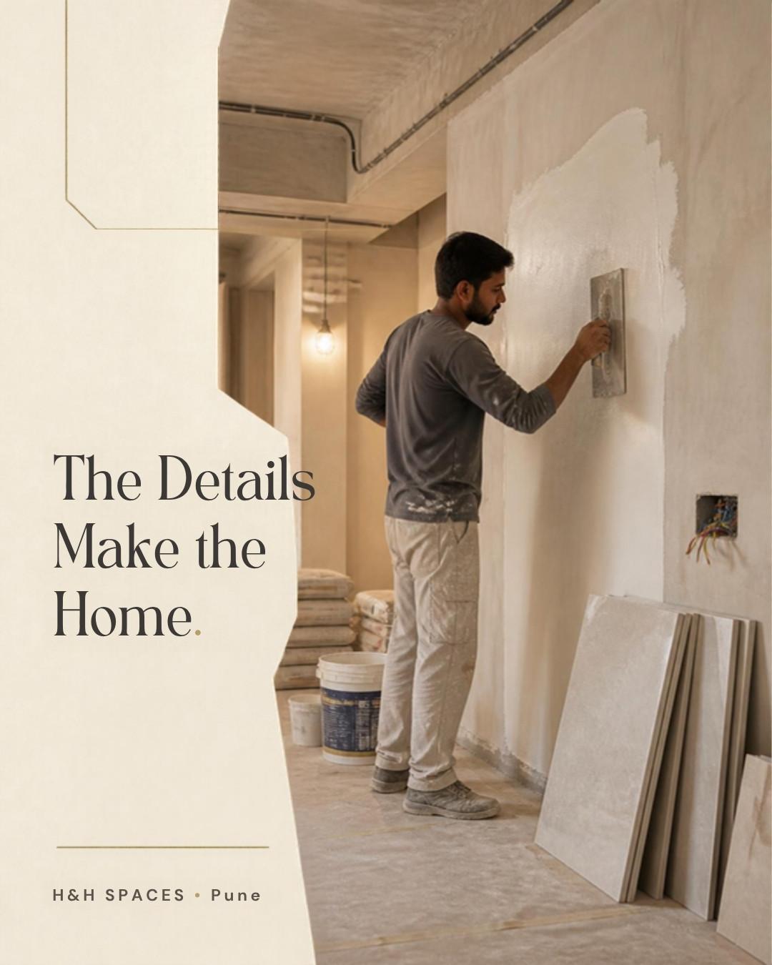 Craftsman applying wall putty during interior finishing of an H&H SPACES home in Pune